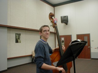 Him and his upright bass at school...